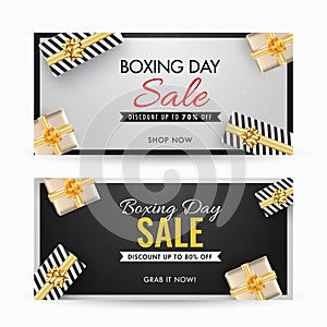 Boxing Day Sale banner design with different discount offer and the top view of gift boxes decorated on grey and black background