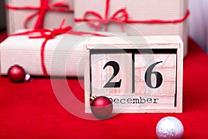 Boxing Day Sale. Calendar with date on red background. Christmas concept. December 26. Christmas ball and gifts