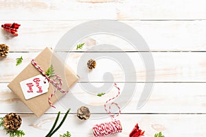 Boxing day Sale text on a white tag with gift box, pine cones, red bell on a wooden white background. Online Shopping