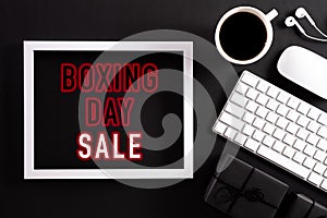 Boxing daySale text on white picture frame with keyboard mouse coffee cup, gift box on white background. Online Shopping concept