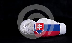 Boxing glove with Slovakia flag on black background