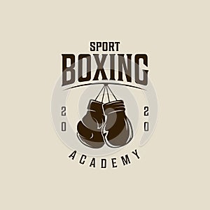 Boxing Gloves Hanging logo vector vintage illustration template icon graphic design. fight sport sign or symbol for academy or