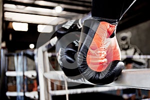 Boxing gloves hanging on ring