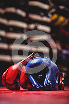 Boxing gloves and headgear in boxing ring