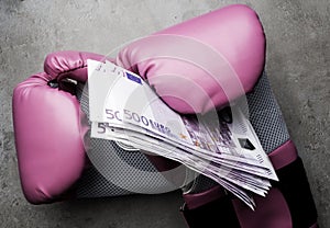 Boxing gloves and money. Concept of bribery, dishonesty in sport, greed. Isolated