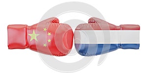Boxing gloves with Netherlands and China flags. Governments photo