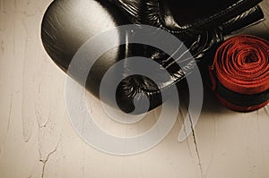 Boxing gloves and red bandage/boxing gloves and red bandage on a stone background