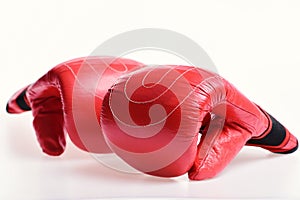 Boxing gloves in red color isolated on white background