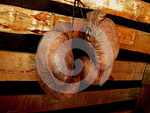 Boxing Gloves On The Wall. Old, Vintage Pair Of Leather Mittens