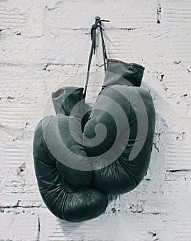 Boxing Gloves White Brick Wall Bacvkground. Rarity Old Box Equipment