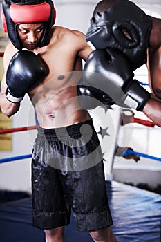 Boxing, man and sparring partner in ring together with headgear, gloves and fitness, power training, challenge. Strong