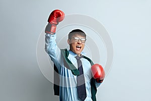 Boxing Man Winning Studio. Extremely Happy Asian Guy Raised Arm Gesturing Yes