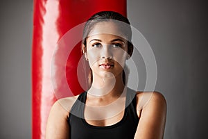 Boxing is my life. Cropped portrait of an attractive young female boxer training in the gym.