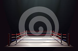 Boxing ring isolated on black abstract background lit by a spotlight