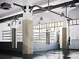 Boxing ring and punching bags in a gym interior. 3d rendering