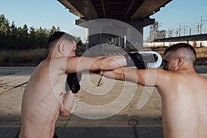 Boxing sparring. two boxers fighting in boxing gloves