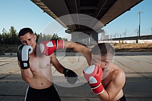 Boxing sparring. two boxers fighting in boxing gloves