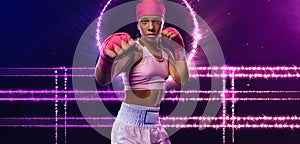 Boxing. Teenager boxer in neon lights. Kids sport concept. Girl sportsman muay thai boxer fighting in gloves in boxing