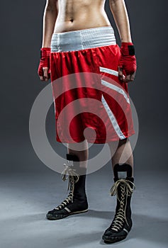 Boxing woman in red dress, detail photo