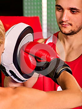 Boxing workout woman in fitness class. Sport exercise two people.