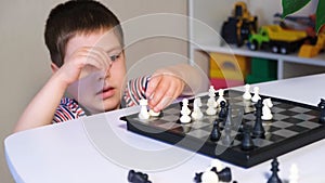 A boy of 4 years old learns to play chess, makes the wrong castling of the tour and the king