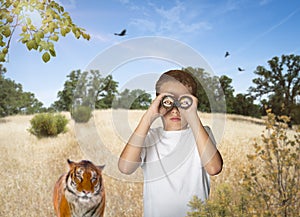 Boy adventurer looking for animals