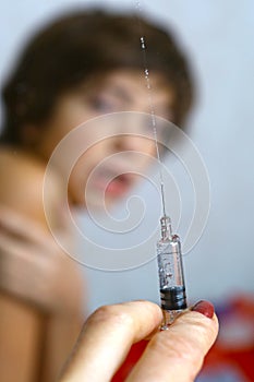 Boy afraid of vaccination syringe