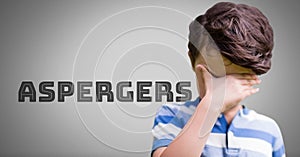 Boy against grey background with Asperger`s text