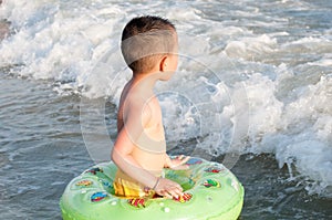 Boy against waves