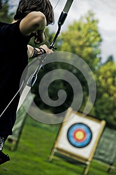 Boy Aiming with Bow