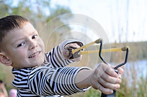 Boy Aiming Sling Shot