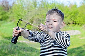 Boy Aiming Sling Shot