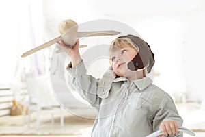 Boy with airplane in hand