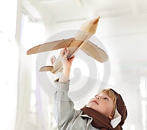 Boy with airplane in hand