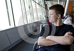 Boy in airport lounge