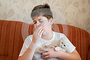 The boy is allergic to cat