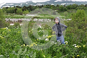 Boy on alpine meadow of Lago-Naki plateau