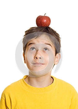 Boy with apple on his head