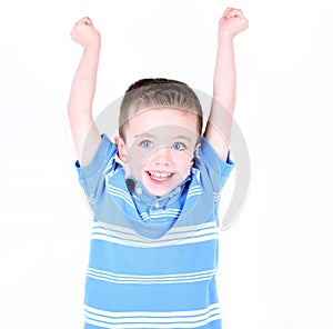 boy with arms up in the air cheering