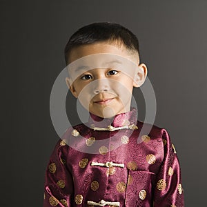 Boy in Asian attire.