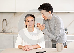 Boy asking mother for forgiveness