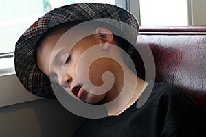 Boy Asleep In Booth photo