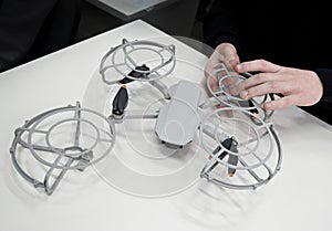 a boy assembles a drone. hands close up and drone