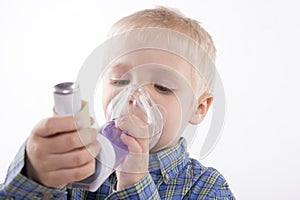 Boy with asthma inhaler