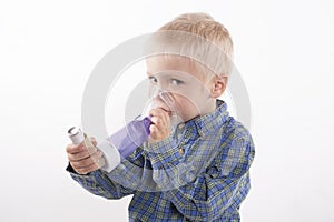 Boy with asthma inhaler