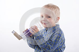 Boy and asthma inhaler photo