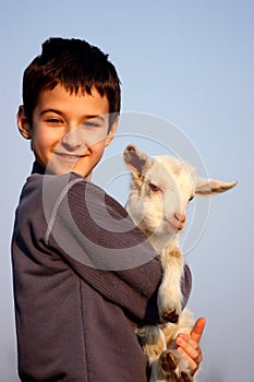 A boy with baby goat