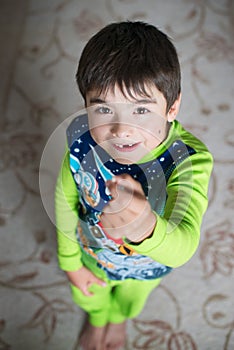 A boy with a baby tooth in full height from above