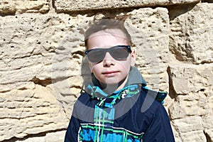 Boy on background of fortress wall