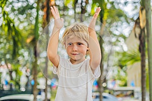 Boy on the background of palm trees
